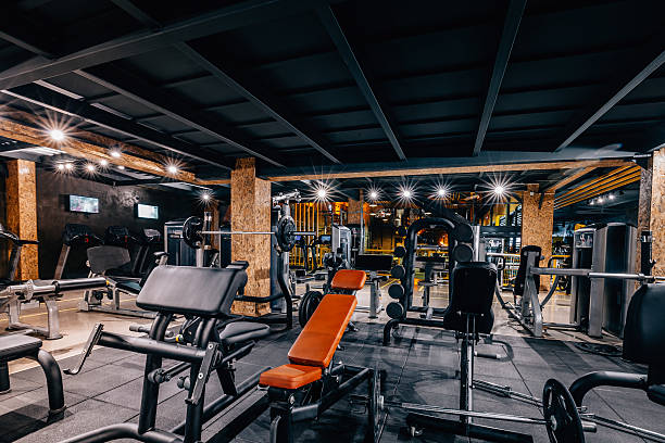 Empty modern and big health and recreation gymnasium club center room with sports equipment